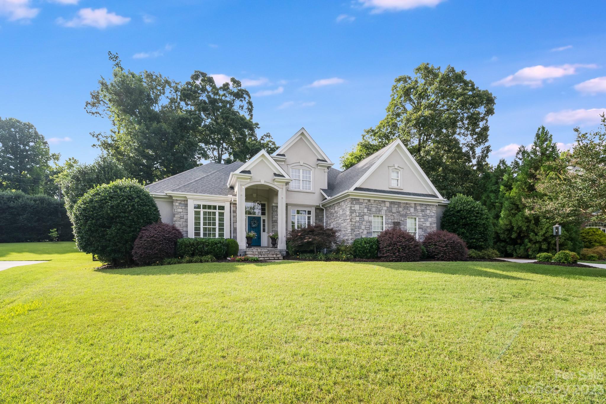 123 Lake Pointe Drive Fort Mill, SC 29708 - Photo 2 of 46 a view of a house with garden and yard