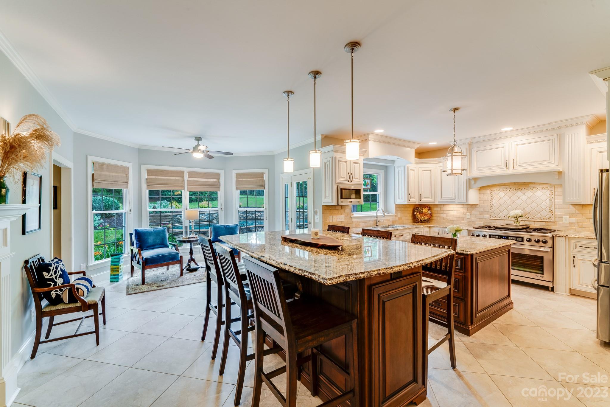 123 Lake Pointe Drive Fort Mill, SC 29708 - Photo 23 of 46 a open kitchen with stainless steel appliances kitchen island granite countertop lots of counter top space and furniture