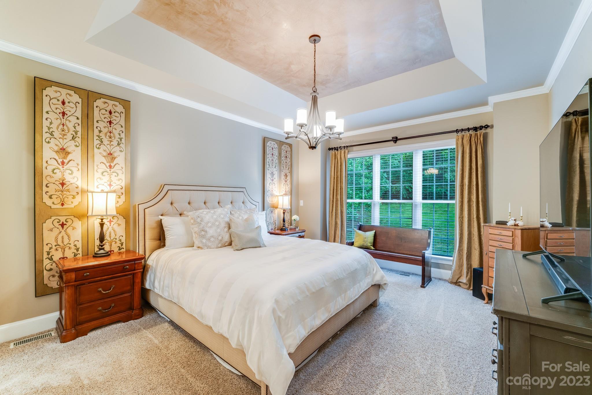 123 Lake Pointe Drive Fort Mill, SC 29708 - Photo 29 of 46 a bedroom with a bed couch and large window