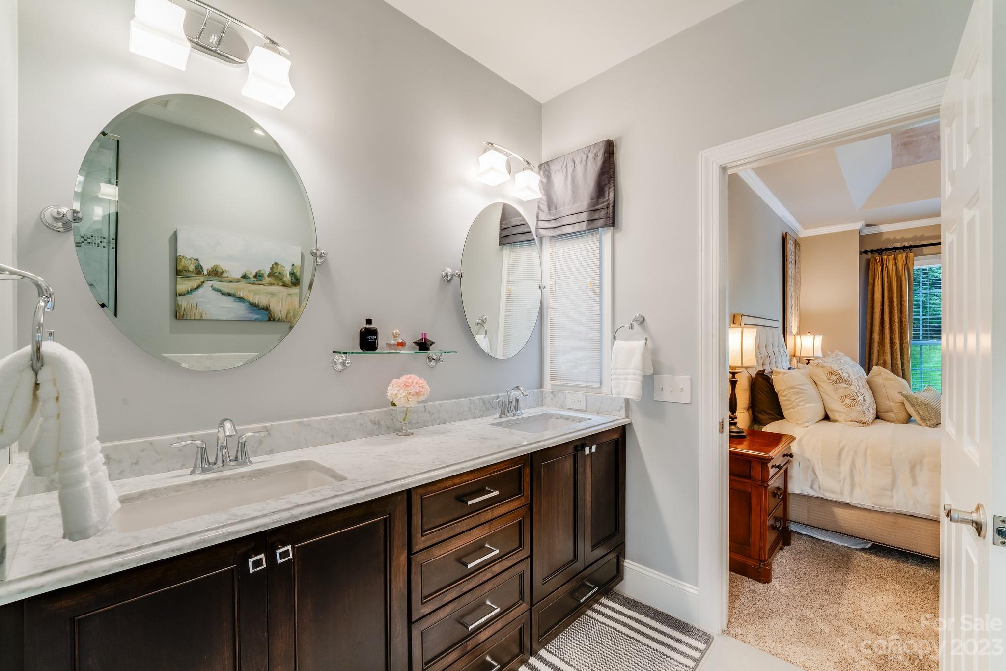 123 Lake Pointe Drive Fort Mill, SC 29708 - Photo 32 of 46 a en suite bathroom with double vanity sinks and a mirror