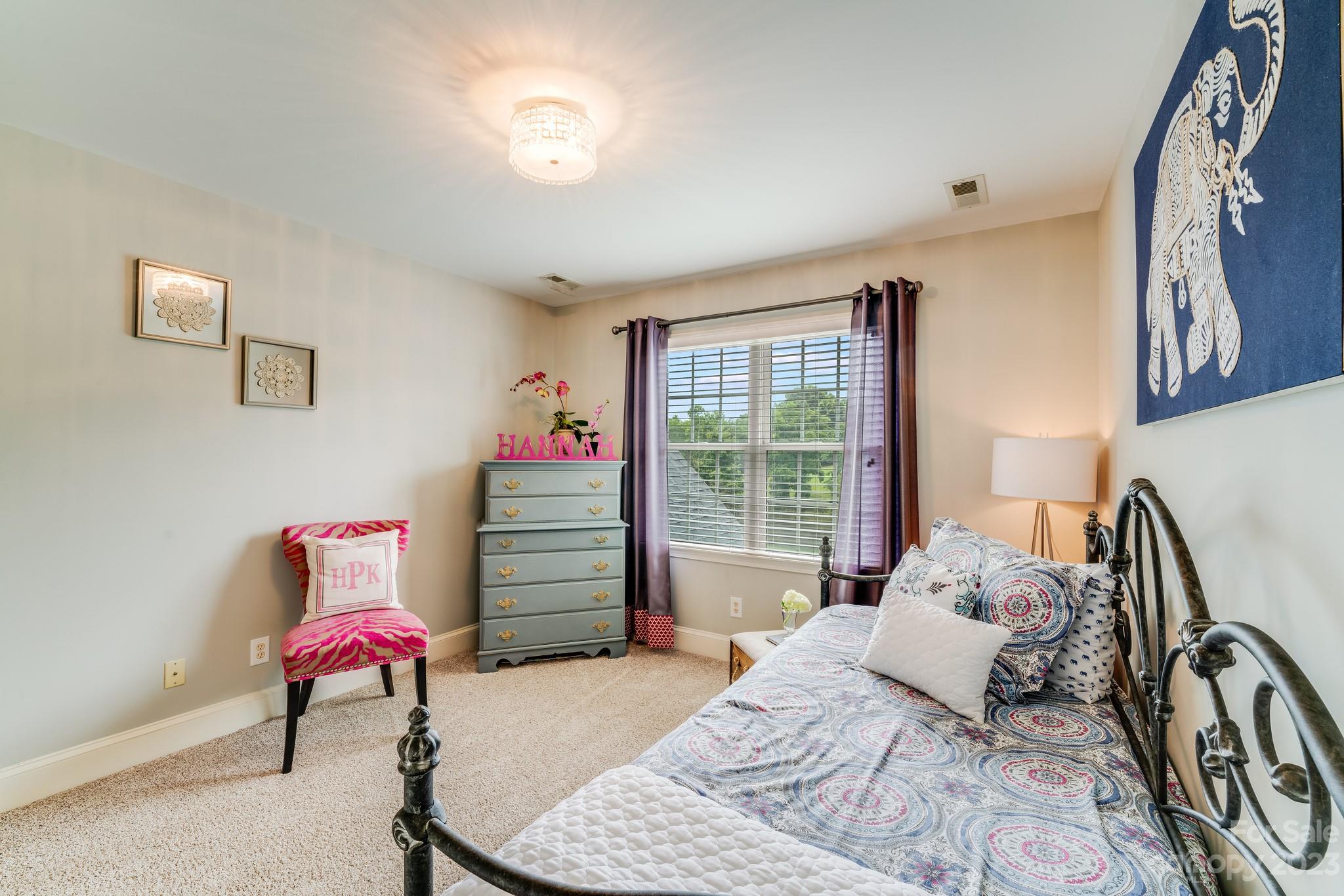 123 Lake Pointe Drive Fort Mill, SC 29708 - Photo 34 of 46 a bedroom with a bed and wooden floor