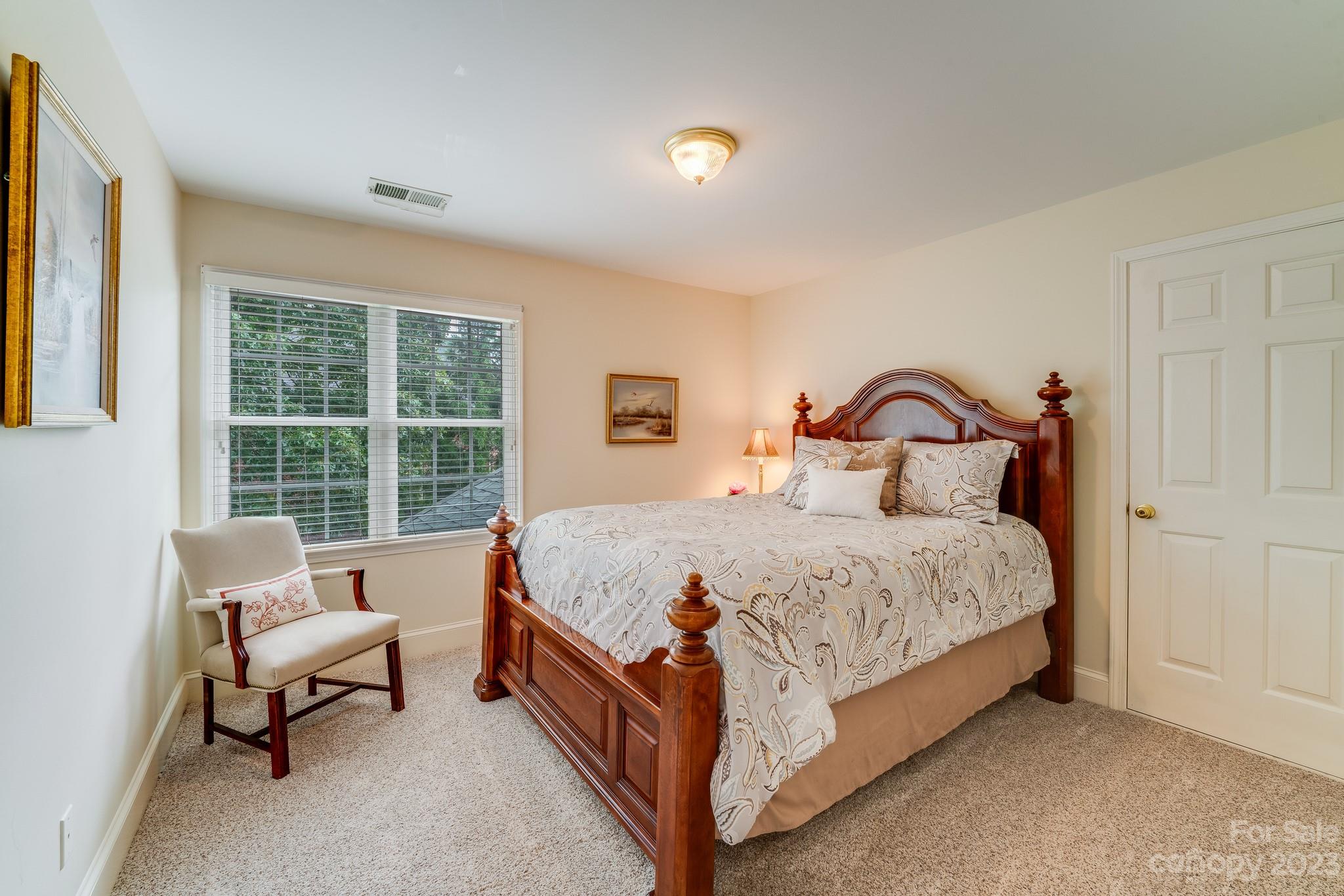 123 Lake Pointe Drive Fort Mill, SC 29708 - Photo 37 of 46 a spacious bedroom with a bed and a window