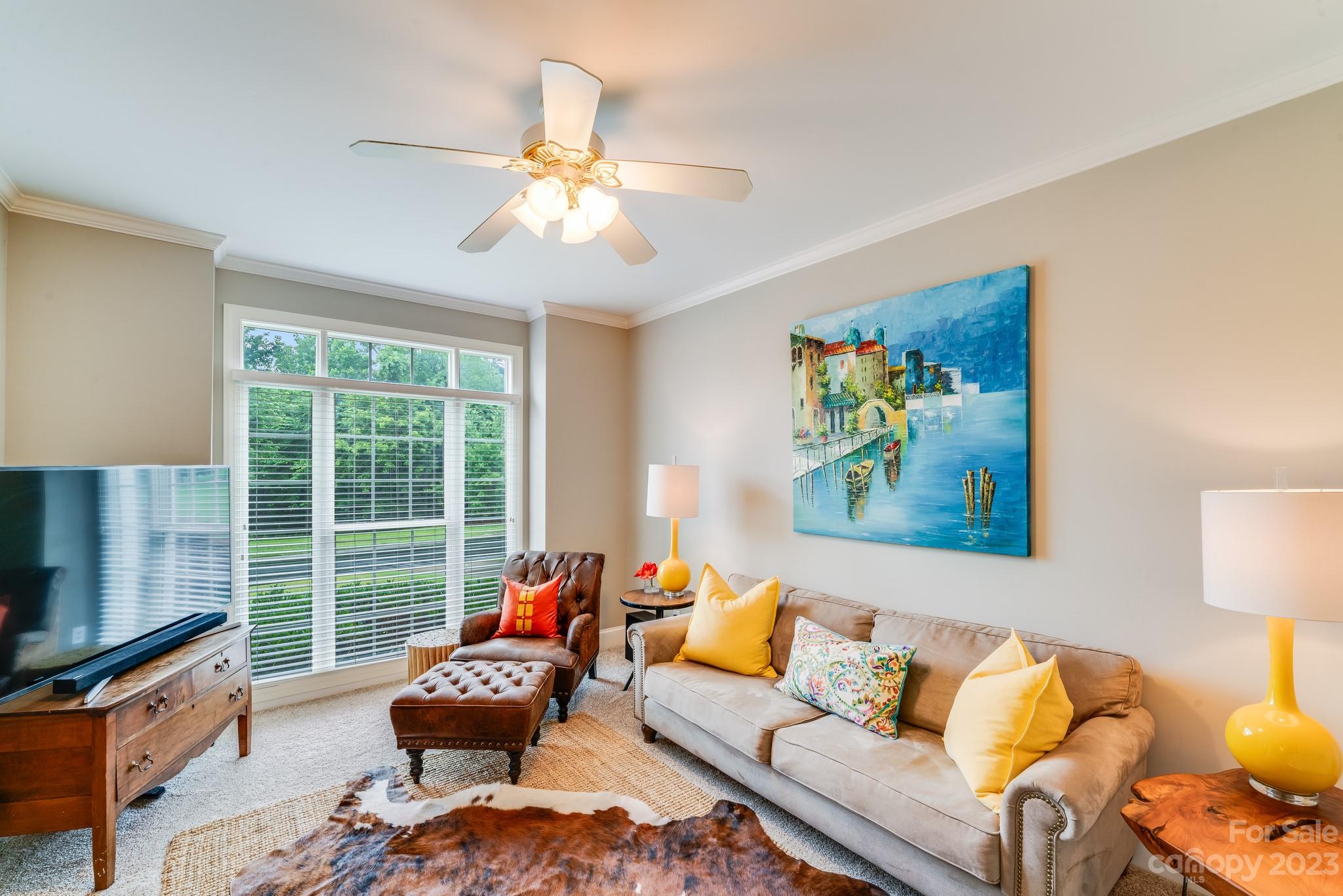 123 Lake Pointe Drive Fort Mill, SC 29708 - Photo 4 of 46 a living room with furniture and a flat screen tv
