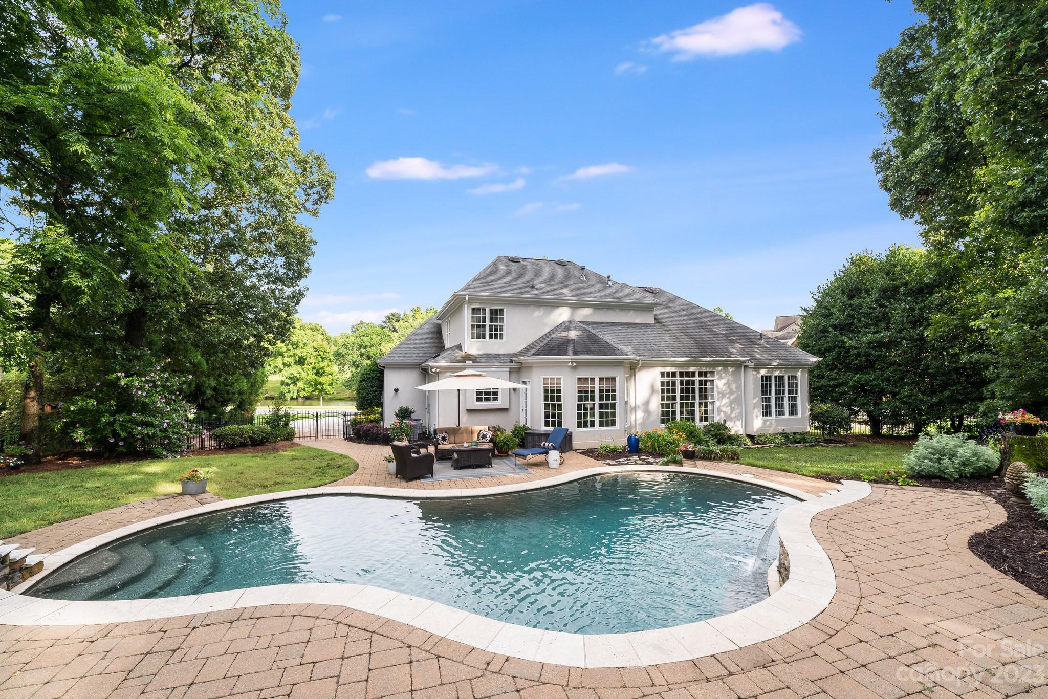 123 Lake Pointe Drive Fort Mill, SC 29708 - Photo 44 of 46 a view of a house with swimming pool and sitting area