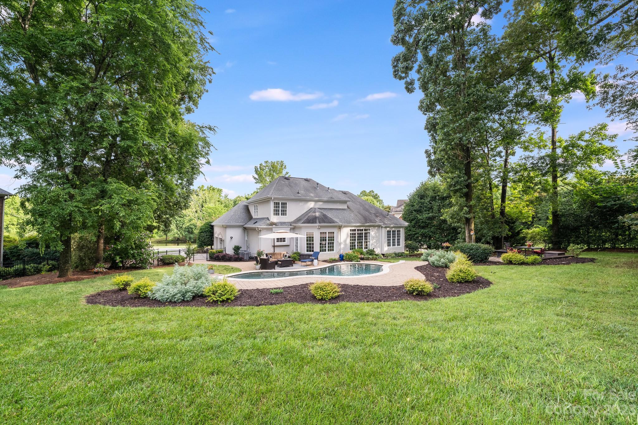123 Lake Pointe Drive Fort Mill, SC 29708 - Photo 45 of 46 a view of a house with a big yard and large trees