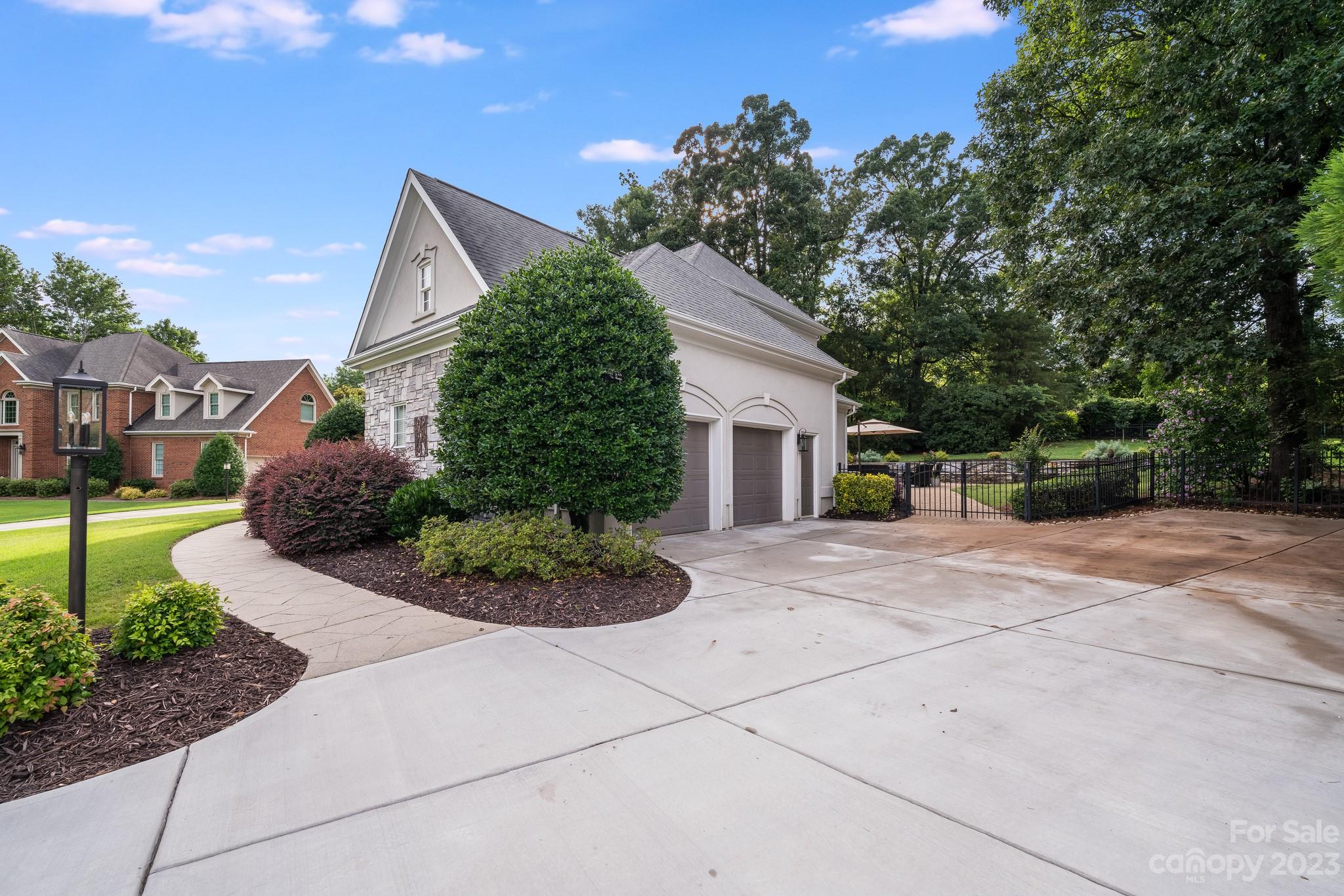 123 Lake Pointe Drive Fort Mill, SC 29708 - Photo 46 of 46 a view of a house with a yard and potted plants