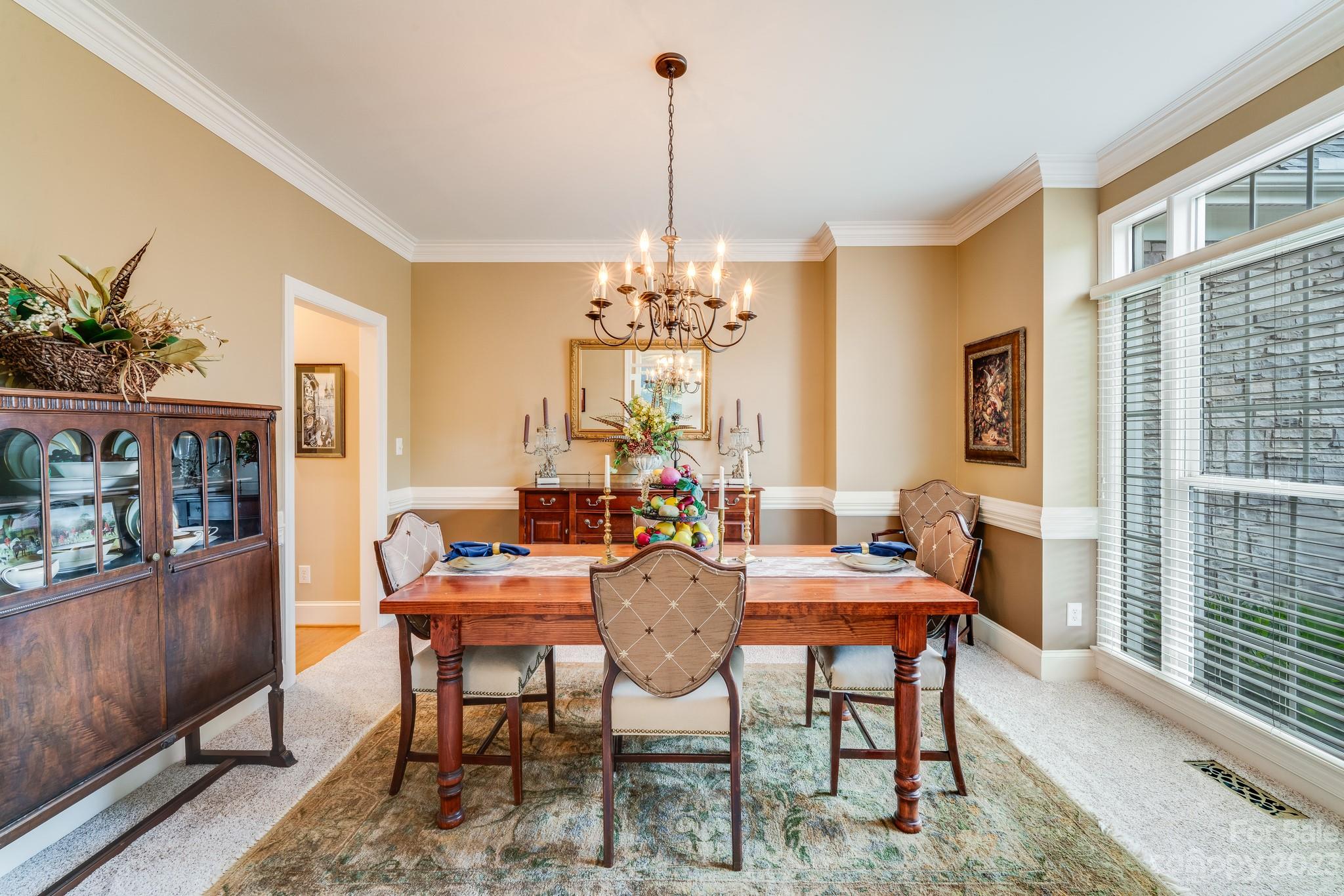 123 Lake Pointe Drive Fort Mill, SC 29708 - Photo 6 of 46 a view of a dining room with furniture window and wooden floor