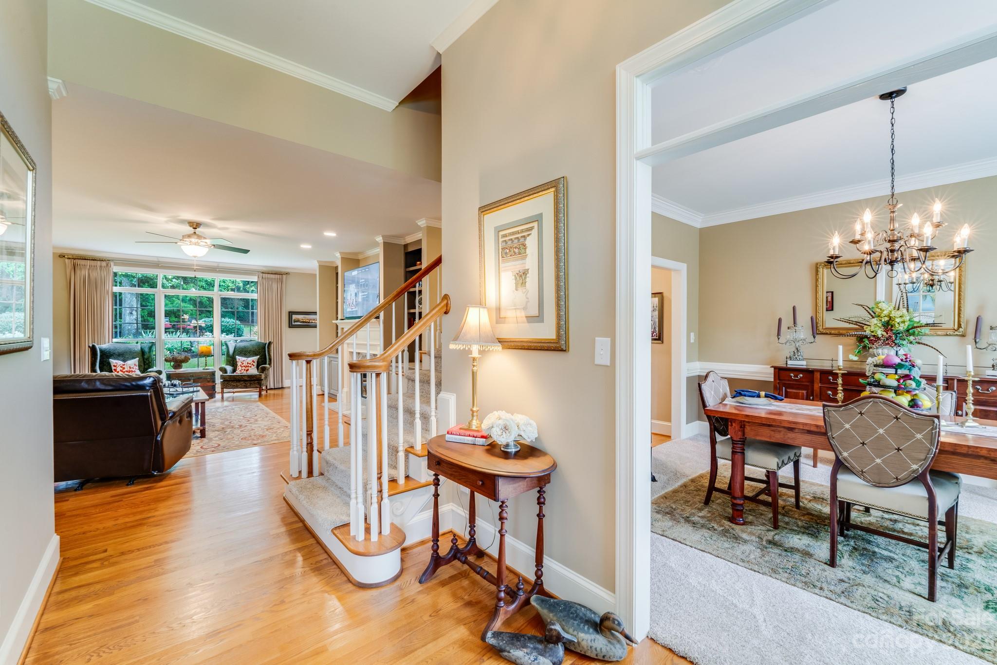 123 Lake Pointe Drive Fort Mill, SC 29708 - Photo 9 of 46 a living room with furniture a piano and floor to ceiling window