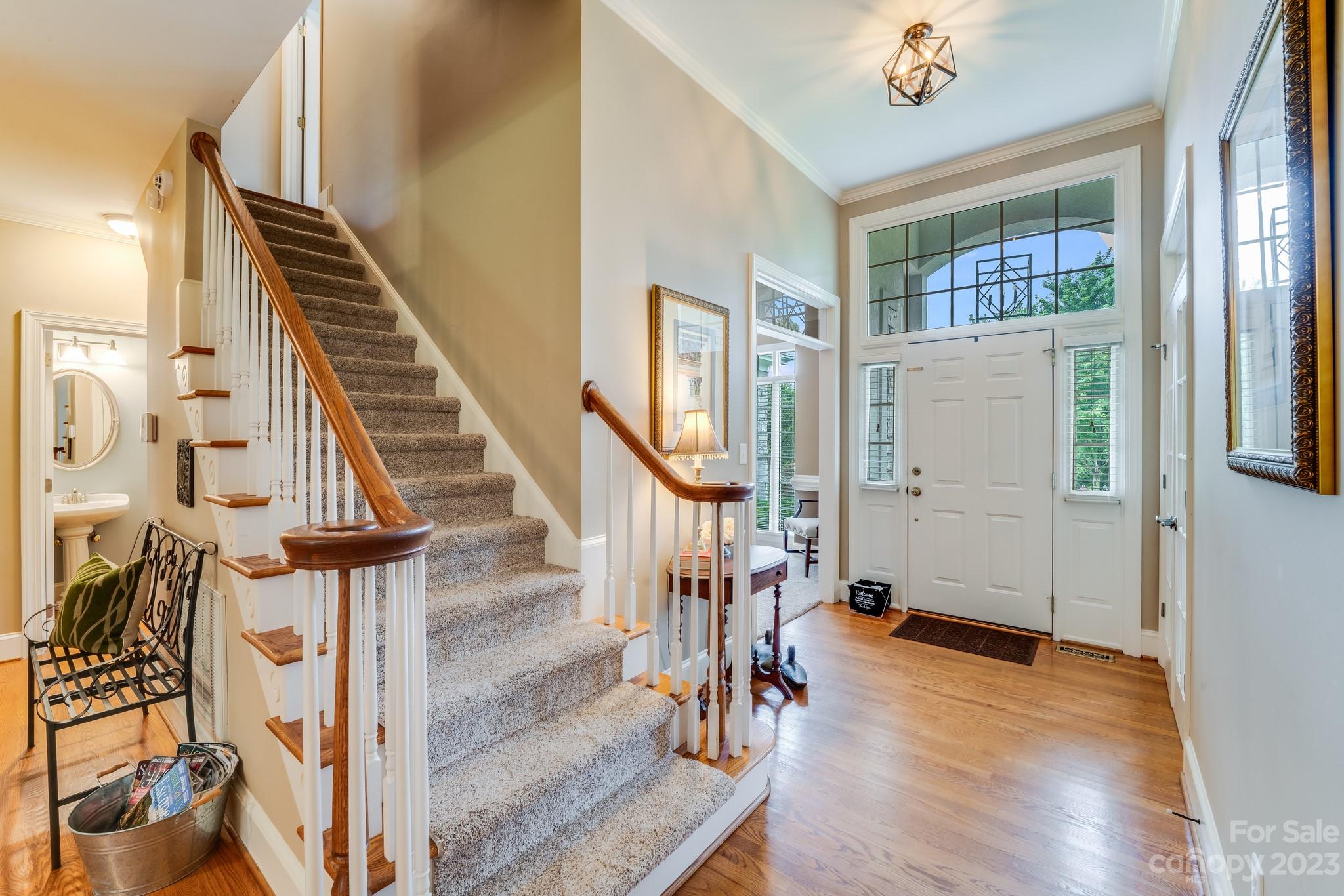 123 Lake Pointe Drive Fort Mill, SC 29708 - Photo 10 of 46 a view of an entryway with wooden floor and staircase