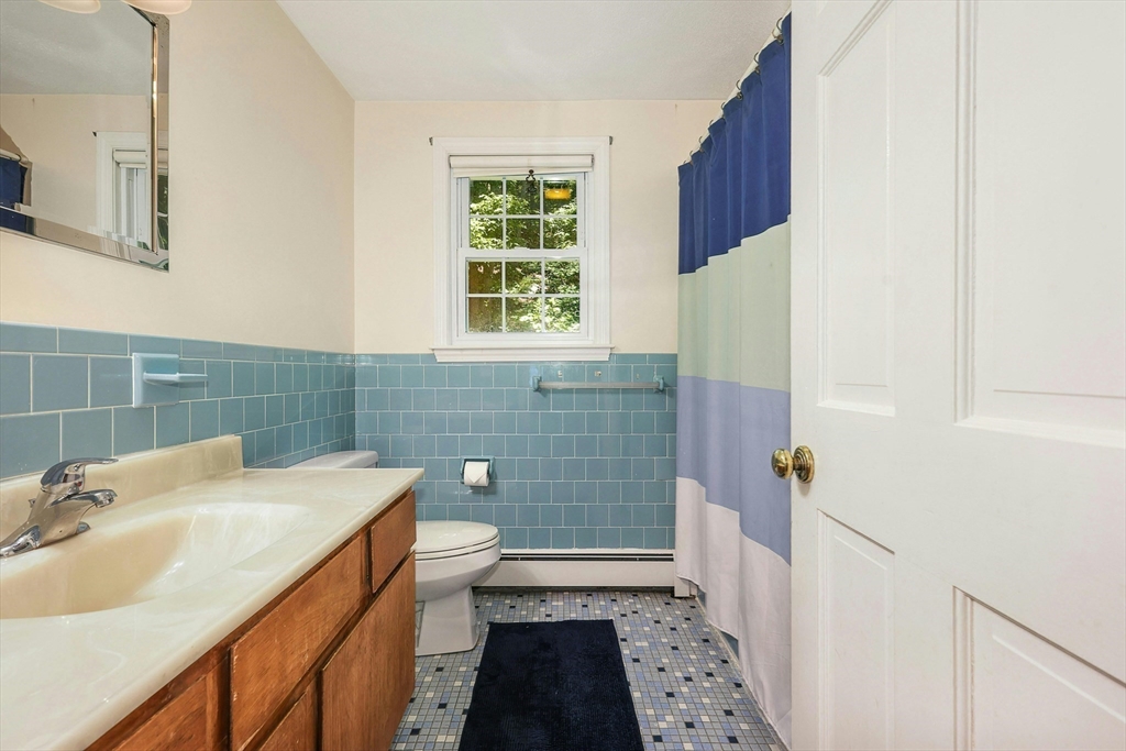 1 Kevin Circle Framingham, MA 01701 - Photo 18 of 25 a bathroom with a sink and a shower