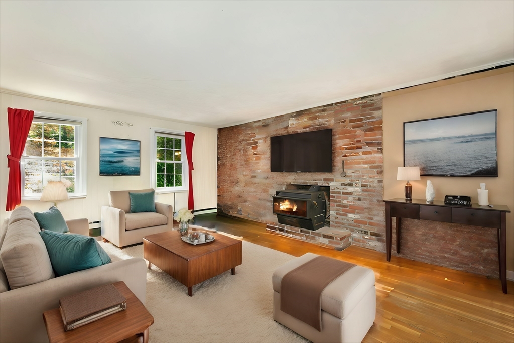 1 Kevin Circle Framingham, MA 01701 - Photo 4 of 25 a living room with fireplace furniture and a flat screen tv