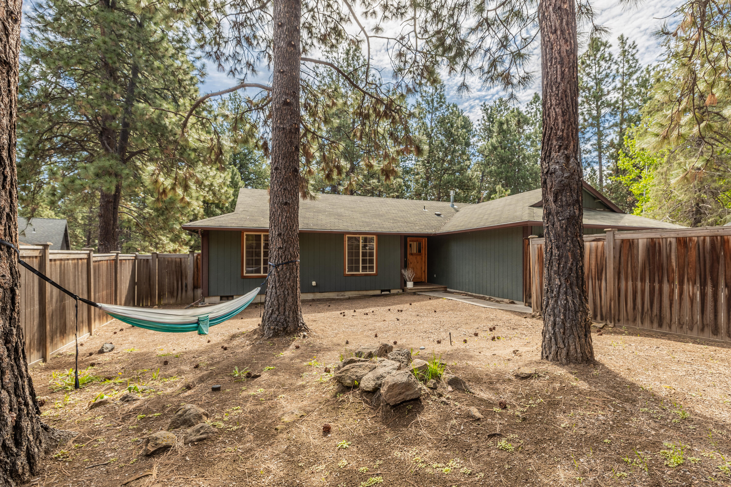19102 Choctaw Road Bend, OR 97702 - Photo 2 of 14 a front view of a house with a yard and garage