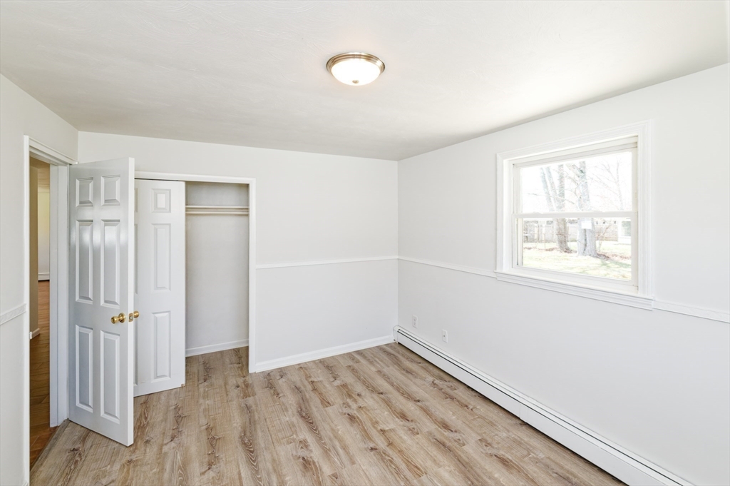 35 Marion Street Holbrook, MA 02343 - Photo 17 of 37 wooden floor in an empty room with a window