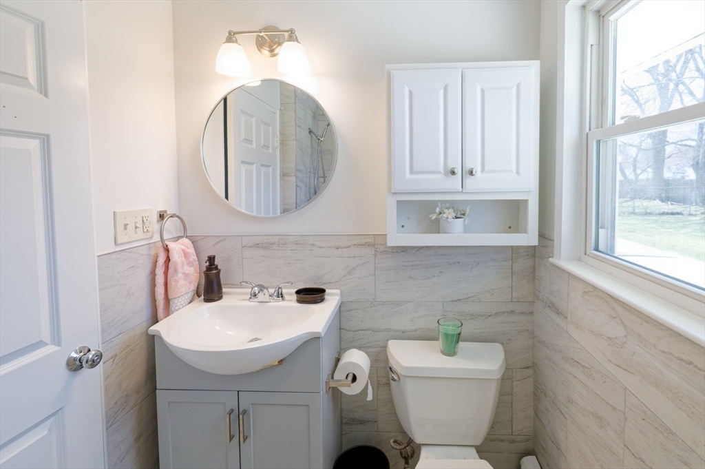 35 Marion Street Holbrook, MA 02343 - Photo 19 of 37 a bathroom with a toilet sink and mirror