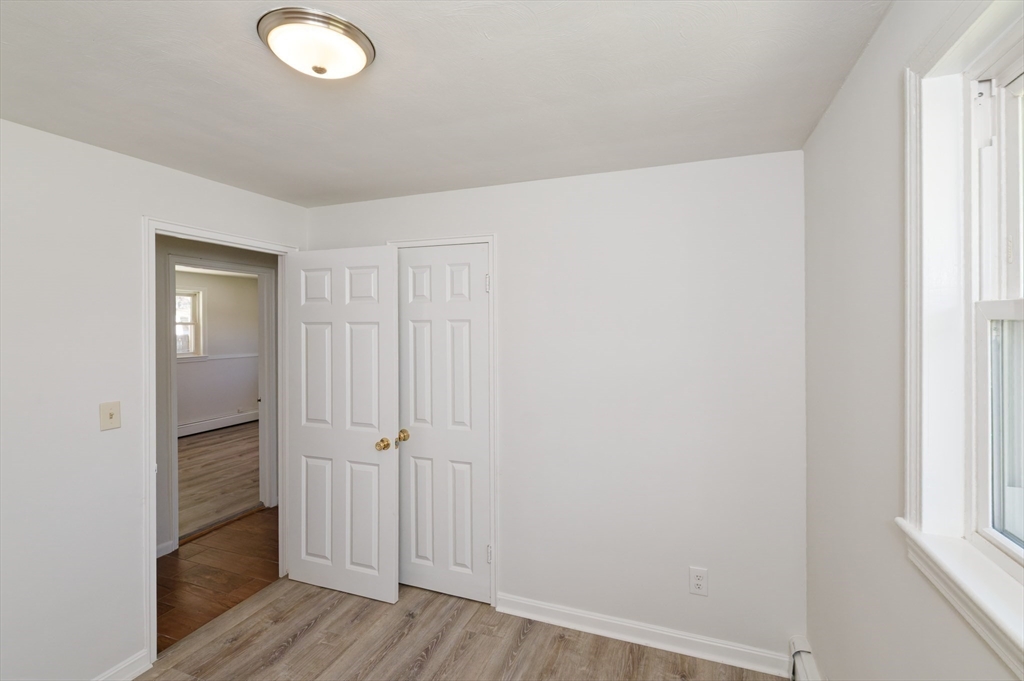35 Marion Street Holbrook, MA 02343 - Photo 26 of 37 an empty room with wooden floor and closet