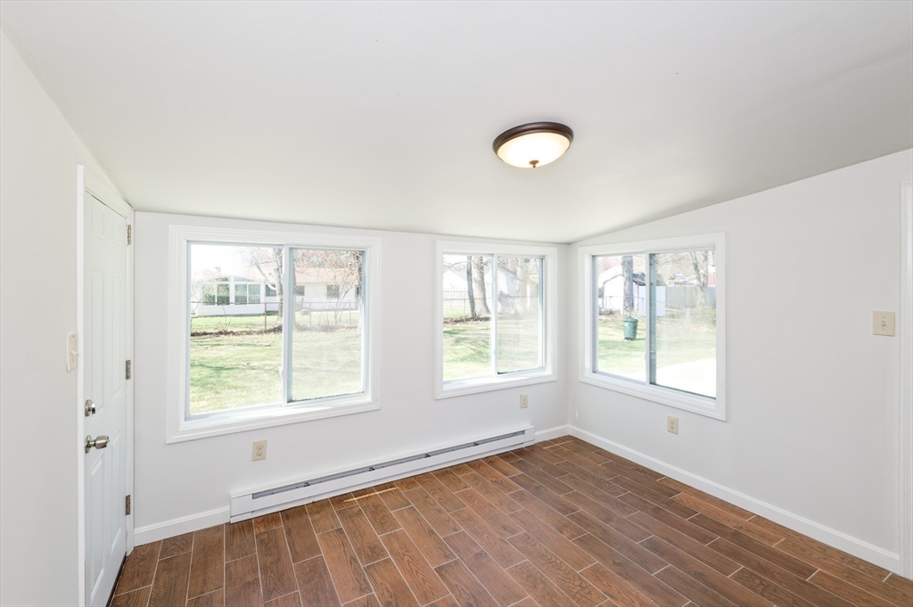 35 Marion Street Holbrook, MA 02343 - Photo 29 of 37 a view of an empty room with wooden floor and a window