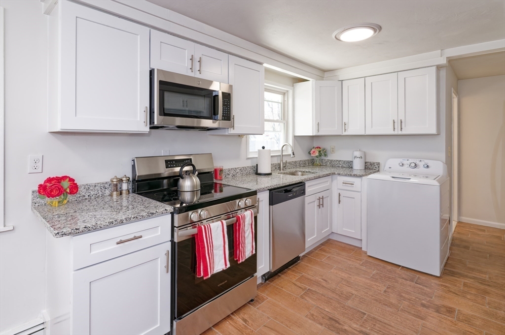 35 Marion Street Holbrook, MA 02343 - Photo 8 of 37 a kitchen with a sink cabinets and appliances