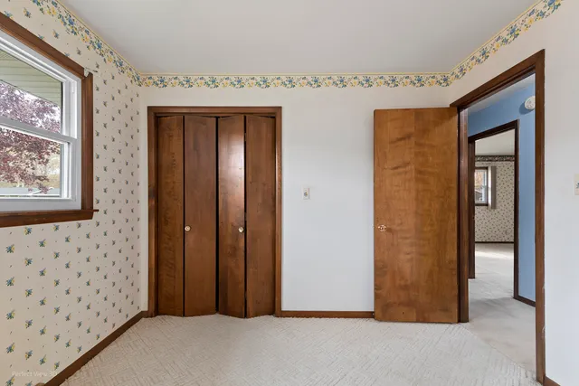 a view of a hallway with entryway door