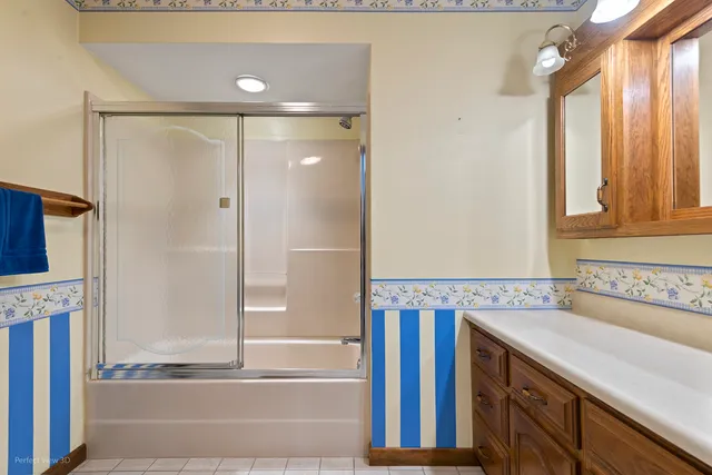 a bathroom with a tub and a sink
