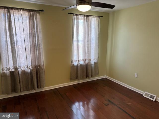 2434 South Percy Street Philadelphia, PA 19148 - Photo 13 of 13 an empty room with wooden floor and a window