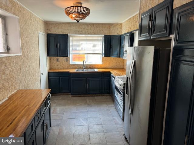 2434 South Percy Street Philadelphia, PA 19148 - Photo 5 of 13 a kitchen with stainless steel appliances granite countertop a refrigerator and a sink