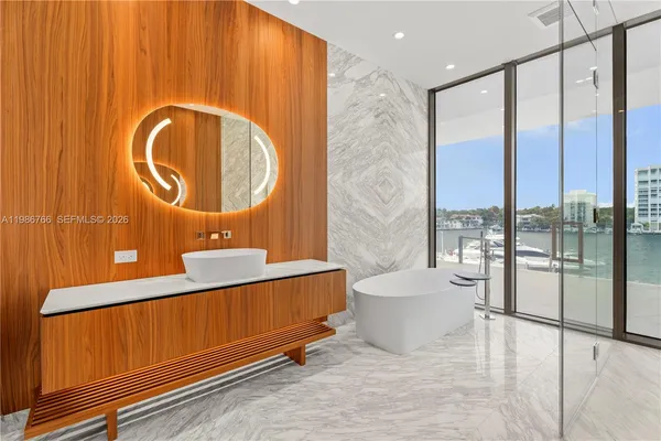 a large bathroom with a large tub and shower