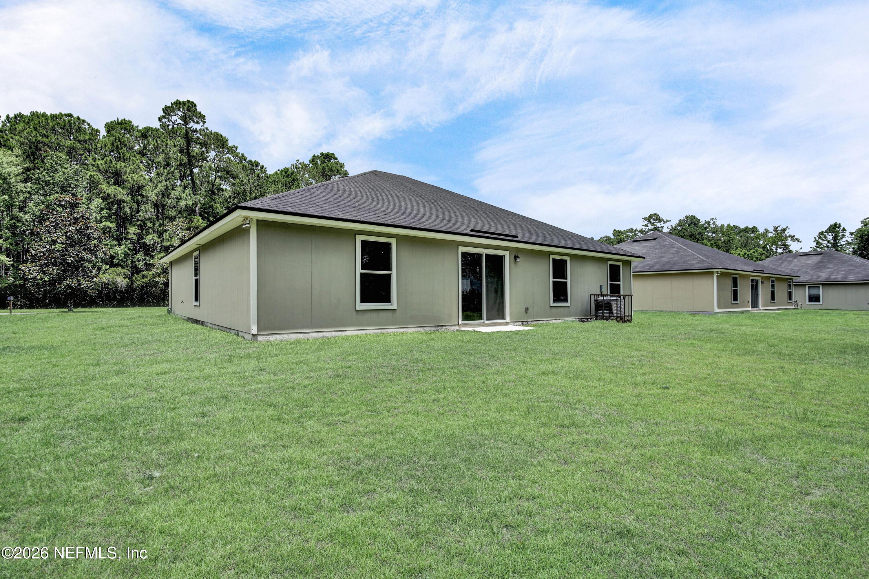 12271 Harts Road Jacksonville, FL 32218 - Photo 16 of 17 a view of a house with a backyard