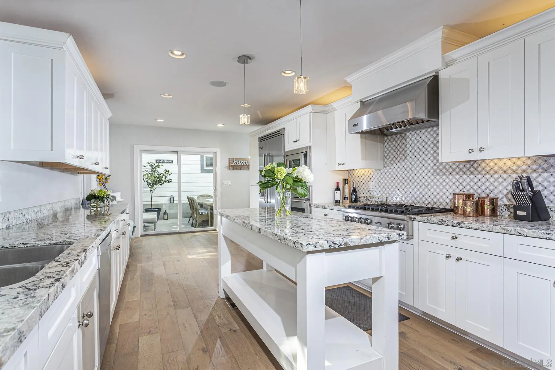 340 A Avenue Coronado, CA 92118 - Photo 12 of 41 a kitchen with stainless steel appliances granite countertop a stove a sink dishwasher and a refrigerator with white cabinets