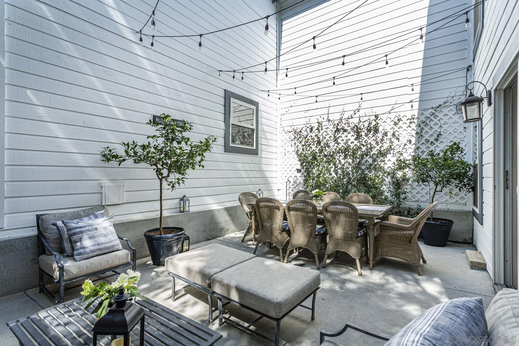 340 A Avenue Coronado, CA 92118 - Photo 15 of 41 a view of backyard of the house with couple of chairs