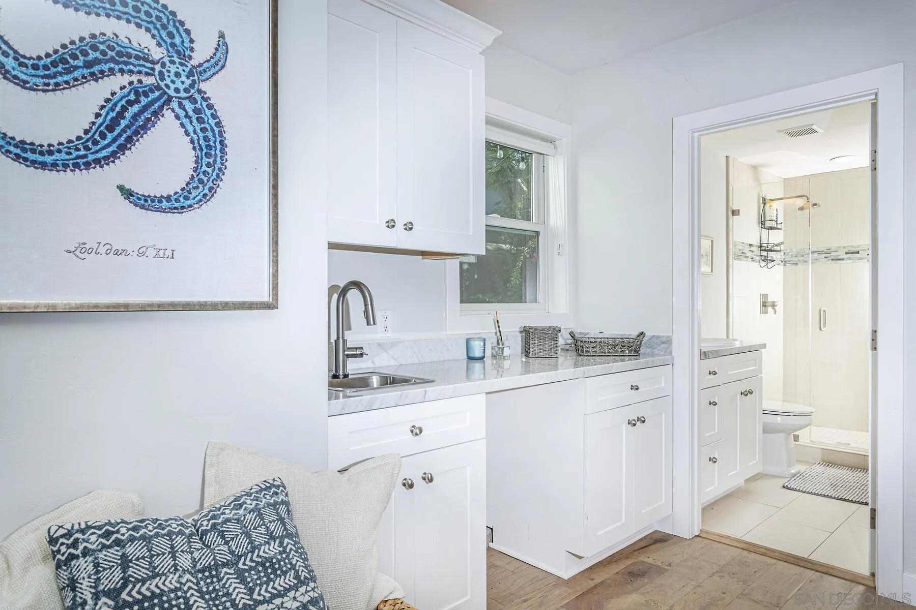 340 A Avenue Coronado, CA 92118 - Photo 20 of 41 a bathroom with a sink a mirror and a shower