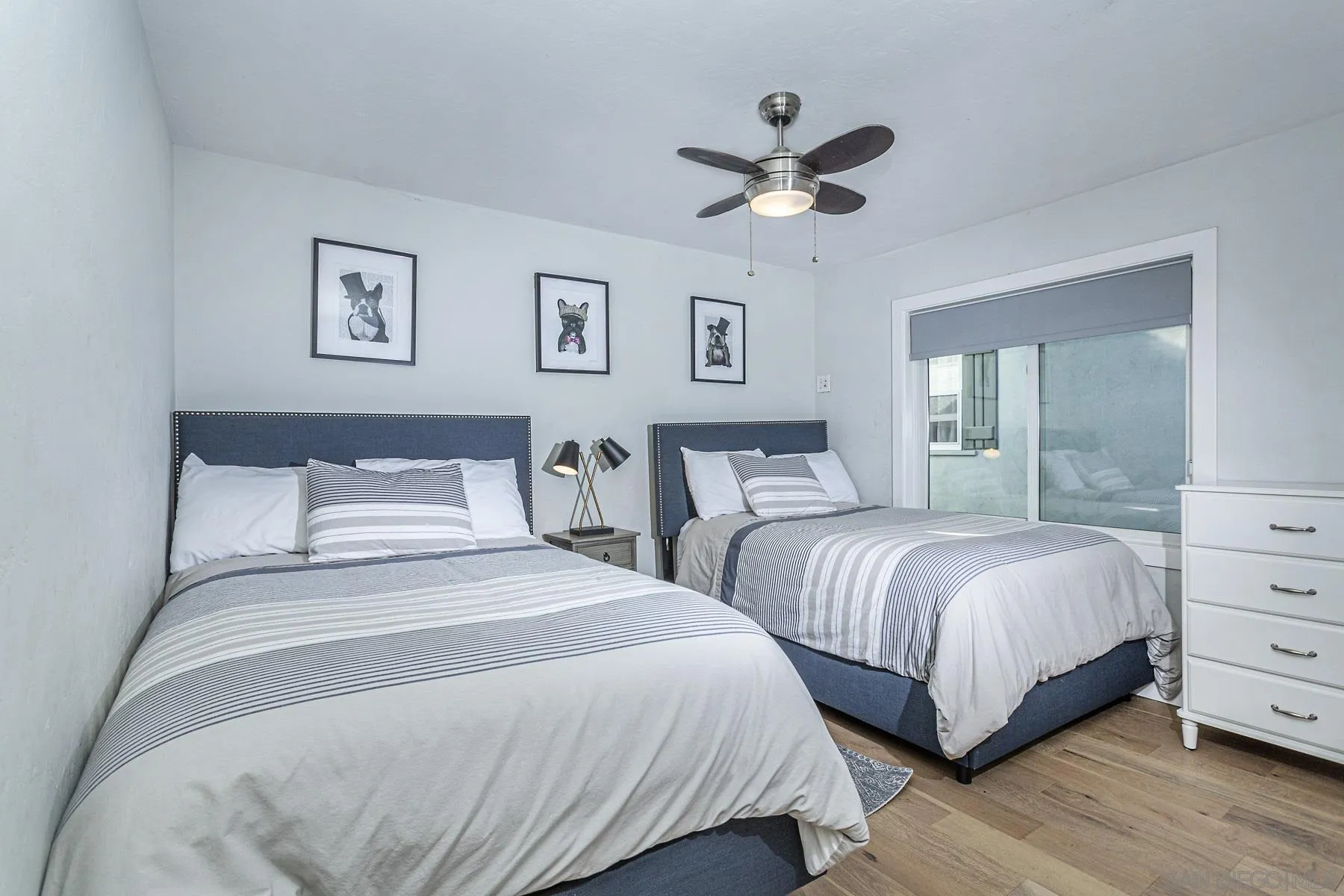 340 A Avenue Coronado, CA 92118 - Photo 28 of 41 a bedroom with two beds and painting on the wall