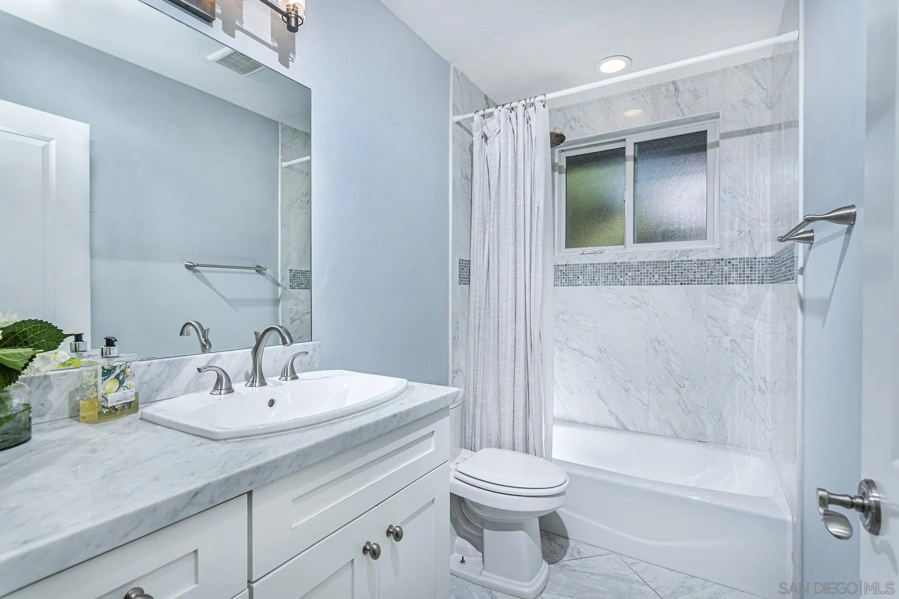 340 A Avenue Coronado, CA 92118 - Photo 29 of 41 a bathroom with a sink a toilet and shower