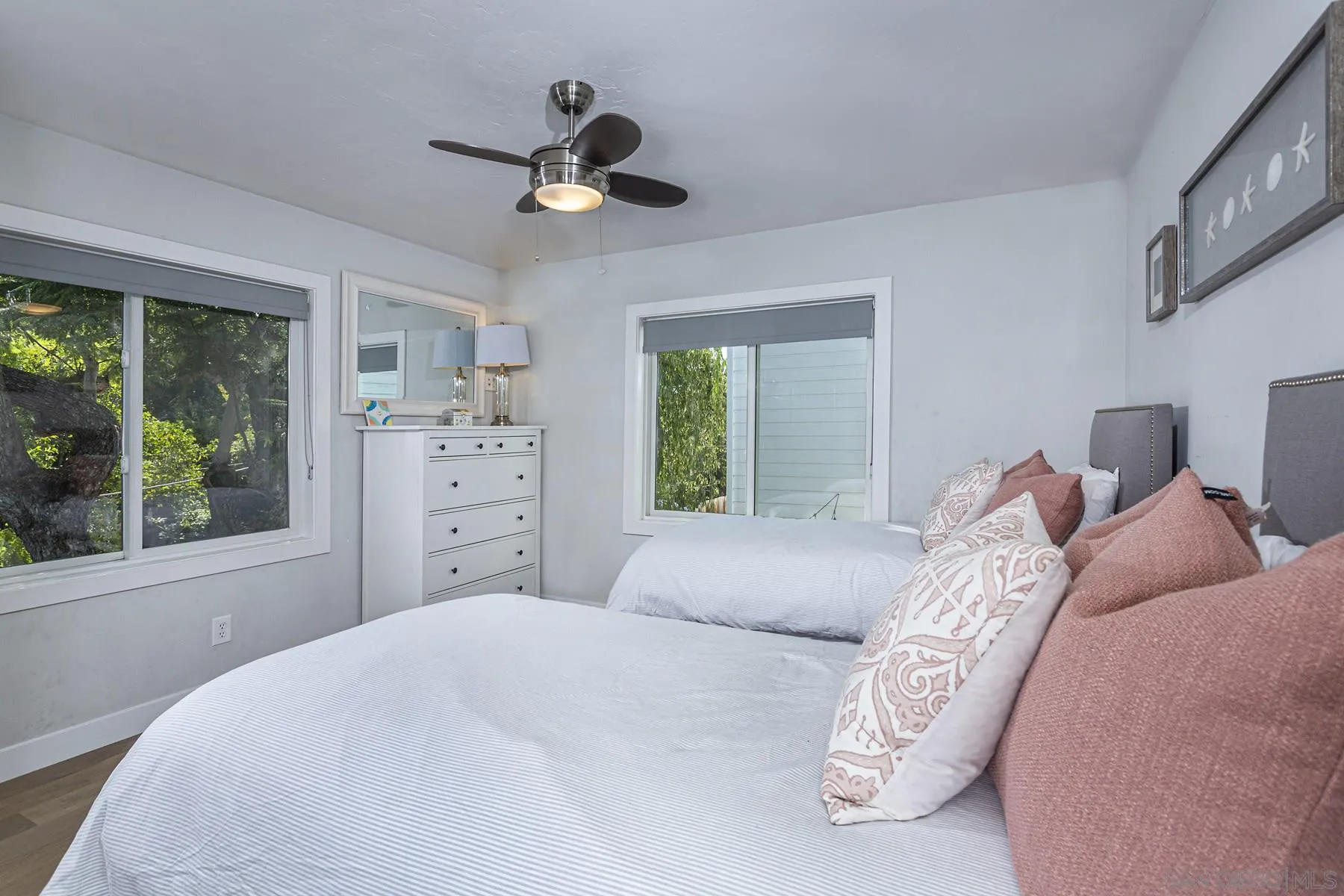 340 A Avenue Coronado, CA 92118 - Photo 30 of 41 a bedroom with a large bed and a window