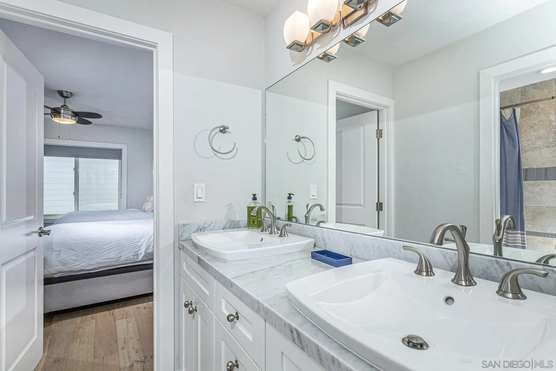 340 A Avenue Coronado, CA 92118 - Photo 31 of 41 a bathroom with double vanity sinks and a mirror
