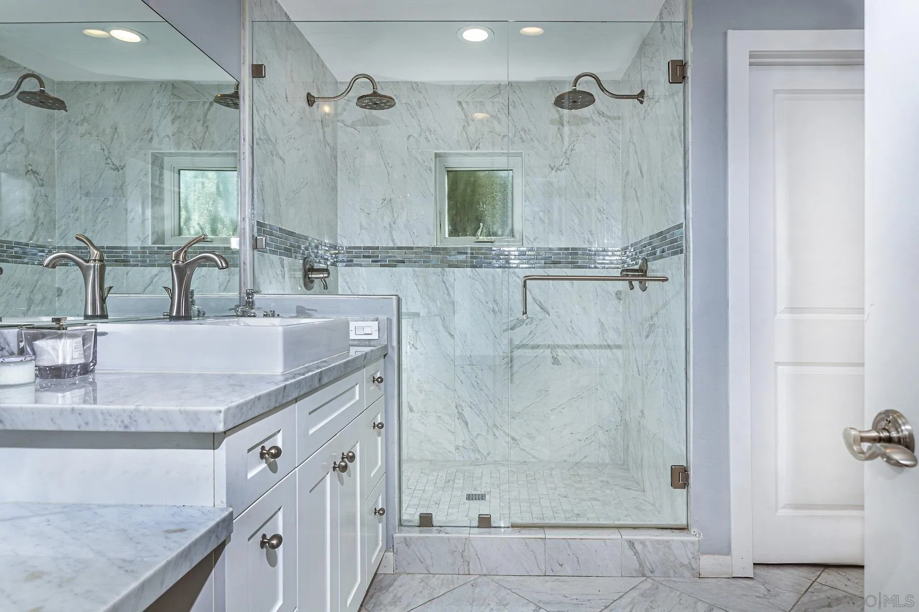 340 A Avenue Coronado, CA 92118 - Photo 39 of 41 a bathroom with a granite countertop shower a sink and a mirror