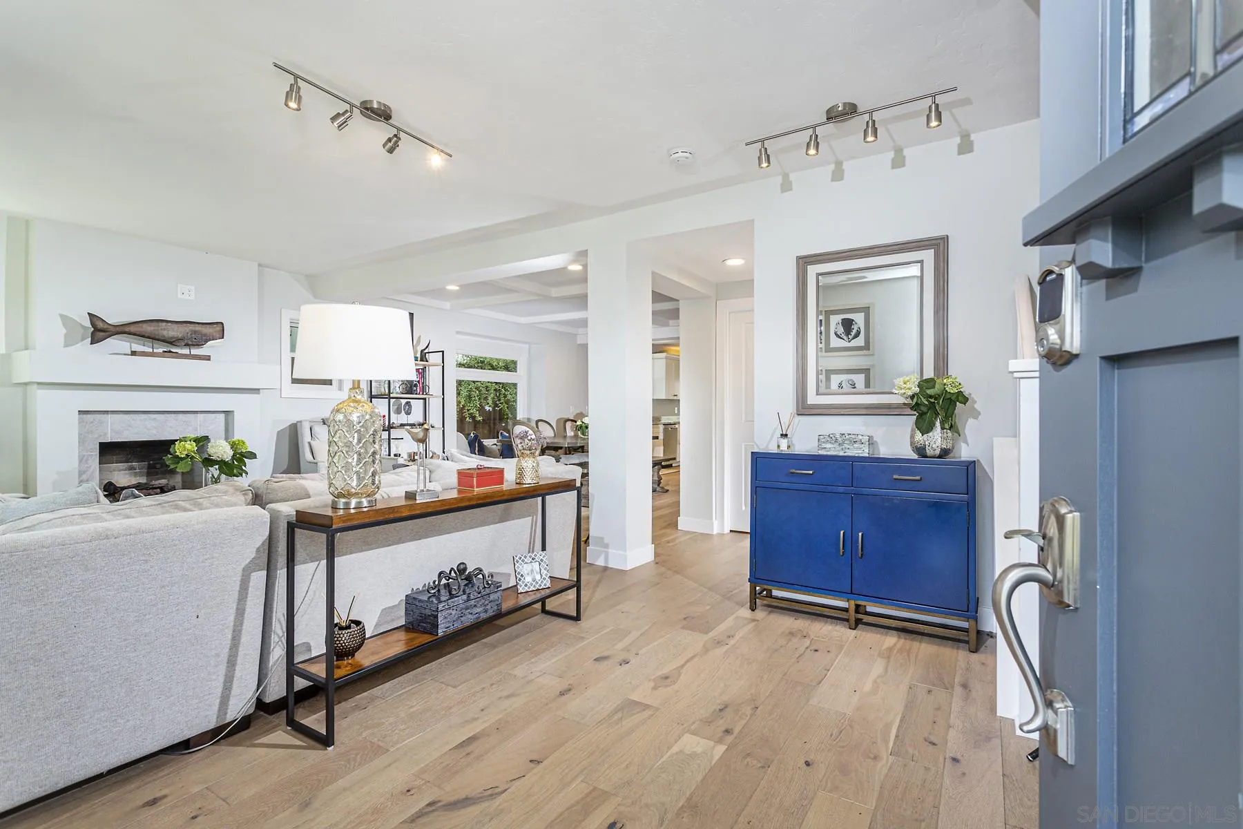 340 A Avenue Coronado, CA 92118 - Photo 6 of 41 a view of living room kitchen with stainless steel appliances granite countertop furniture and fireplace