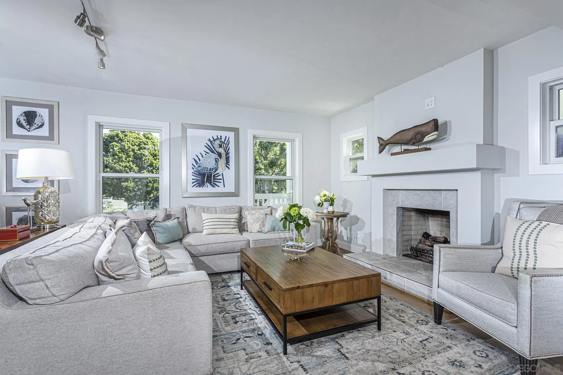 340 A Avenue Coronado, CA 92118 - Photo 8 of 41 a living room with furniture fireplace and window