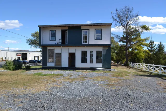 a house that has a big yard in front of it