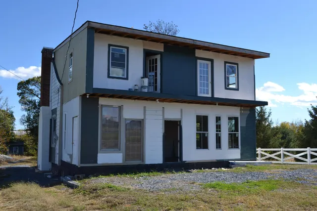 a house view with a backyard space