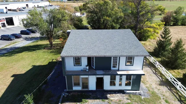 a aerial view of a house with a yard