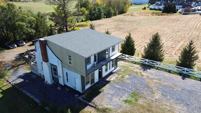 a view of a house with roof deck front of house