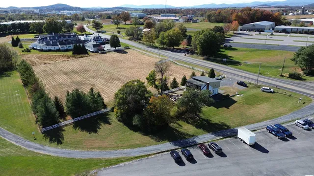 an aerial view of a house having swimming pool