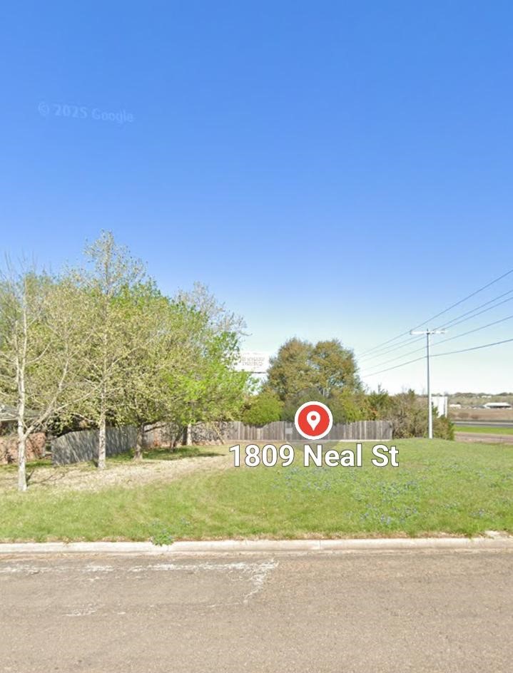 1809 Neal Street Navasota, TX 77868 - Photo 1 of 7 a view of street along with trees