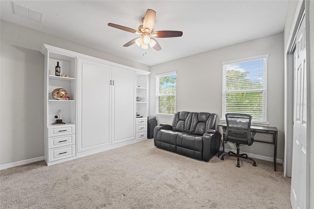8903 Arabella Lane Seminole, FL 33777 - Photo 31 of 47 a living room with furniture and a window