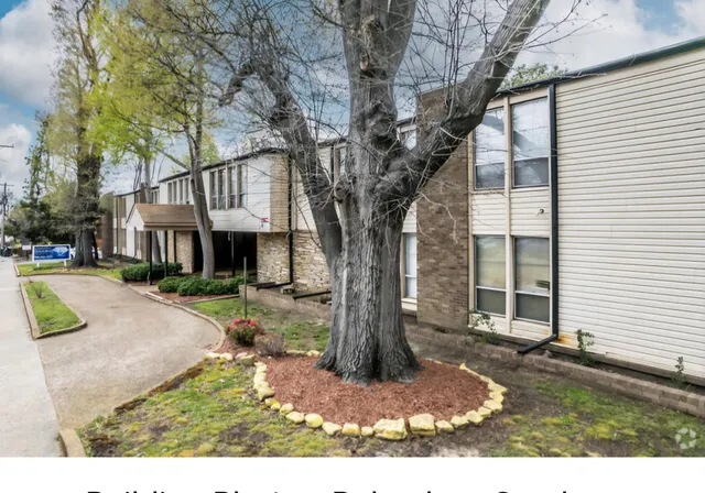 a front view of a house with a yard and porch