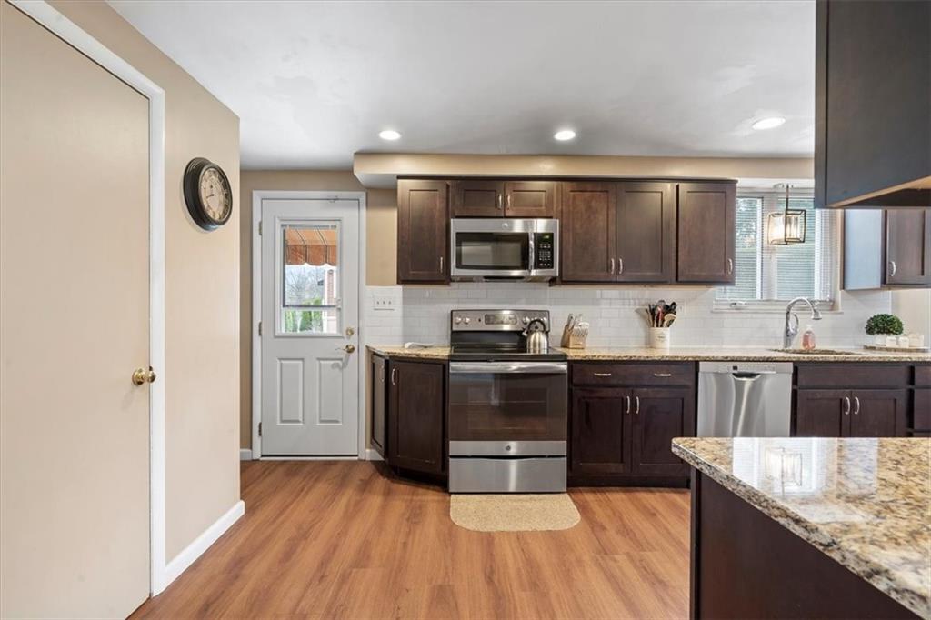 528 Loretto Road Pittsburgh, PA 15217 - Photo 14 of 39 Stainless steel appliances will assist with all of your cooking needs. A side door with built in retractable blind leads to the side porch and street making drop off of groceries easy.