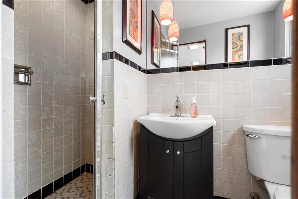 528 Loretto Road Pittsburgh, PA 15217 - Photo 19 of 39 The full bathroom with walk in tiled shower on the main level is ideal for an in-law suite.