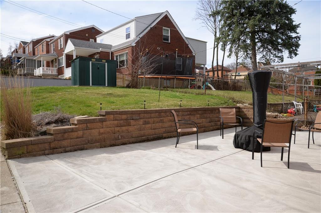 528 Loretto Road Pittsburgh, PA 15217 - Photo 35 of 39 Invite your friends over and enjoy time telling stories around the fire pit on this brand new patio installed in 2024.