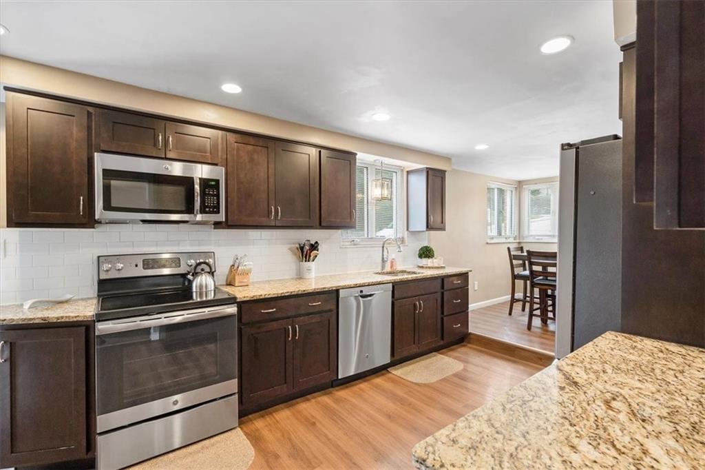 528 Loretto Road Pittsburgh, PA 15217 - Photo 10 of 39 Cooking will be a dream in this completely renovated kitchen. Granite countertops, tile backsplash and update cabinets are sure to please.