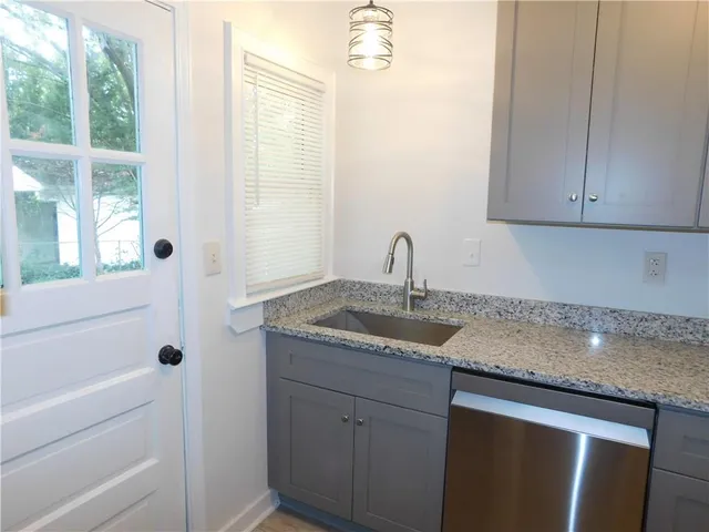 a kitchen with sink cabinets and window